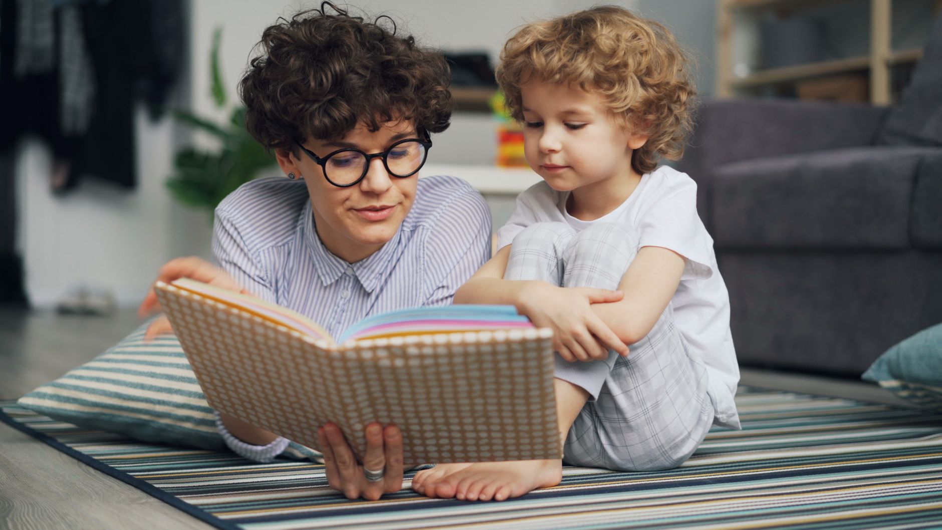 Caregiver reading with a child at home